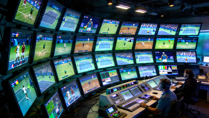 现代体育直播技术控制中心内景 - 多块屏幕显示不同赛事直播信号